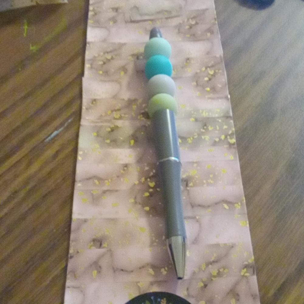 Grey pen with silicone beads on it handmade